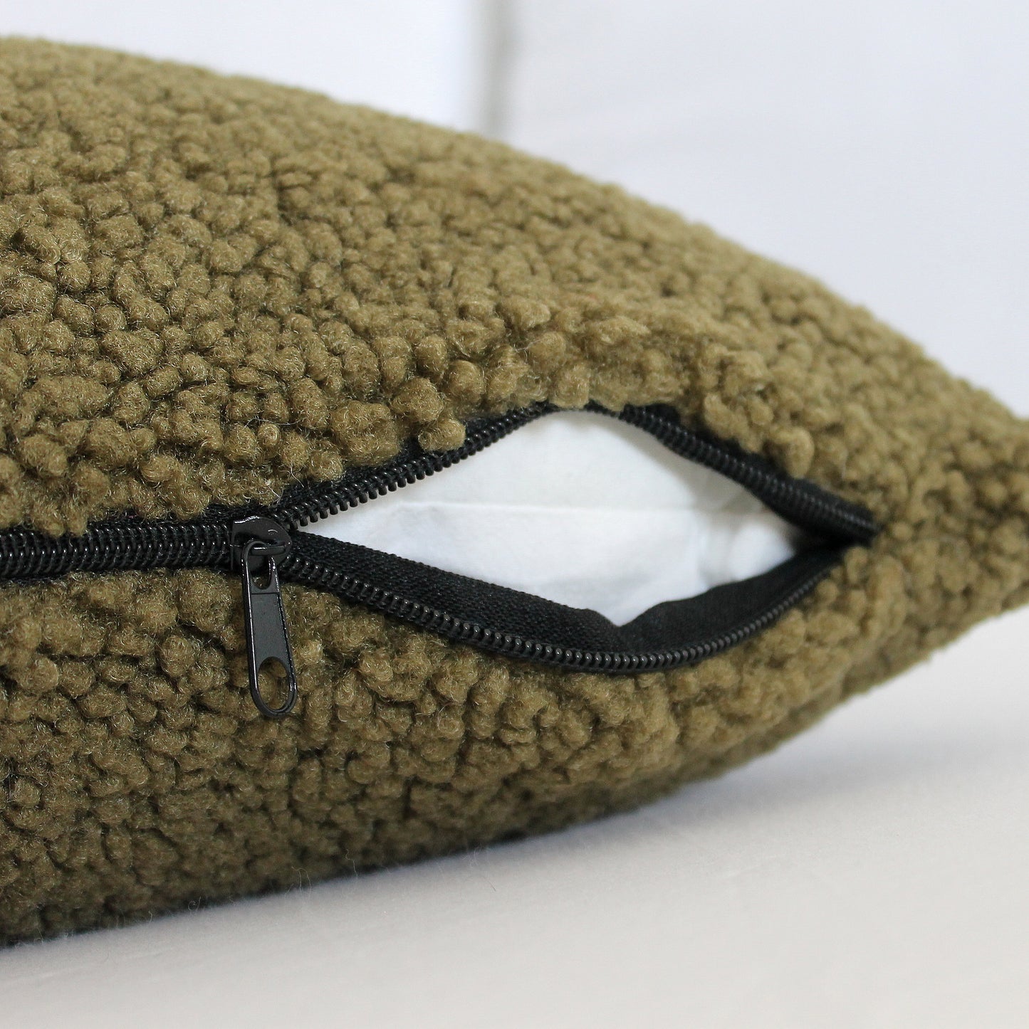 Create a cozy look to your space with this Army Green Cozy Teddy Boucle Throw Pillow Cover. The classic texture adds a warm and inviting touch to your sofa or bed. Comfortable to touch makes it perfect for snuggling up with!