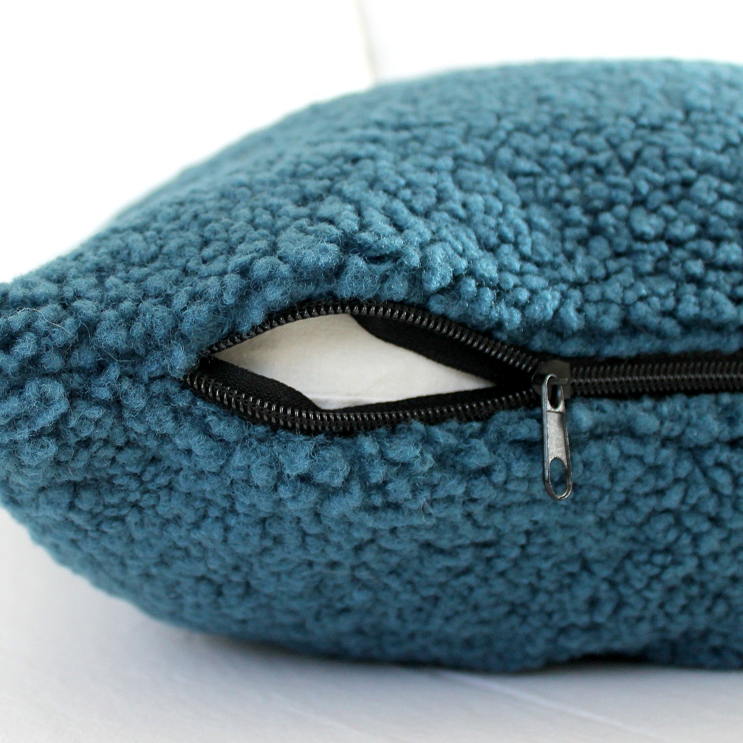 Create a cozy look to your space with this Petrol Blue Cozy Teddy Boucle Throw Pillow Cover. The classic texture adds a warm and inviting touch to your sofa or bed. Comfortable to touch makes it perfect for snuggling up with!