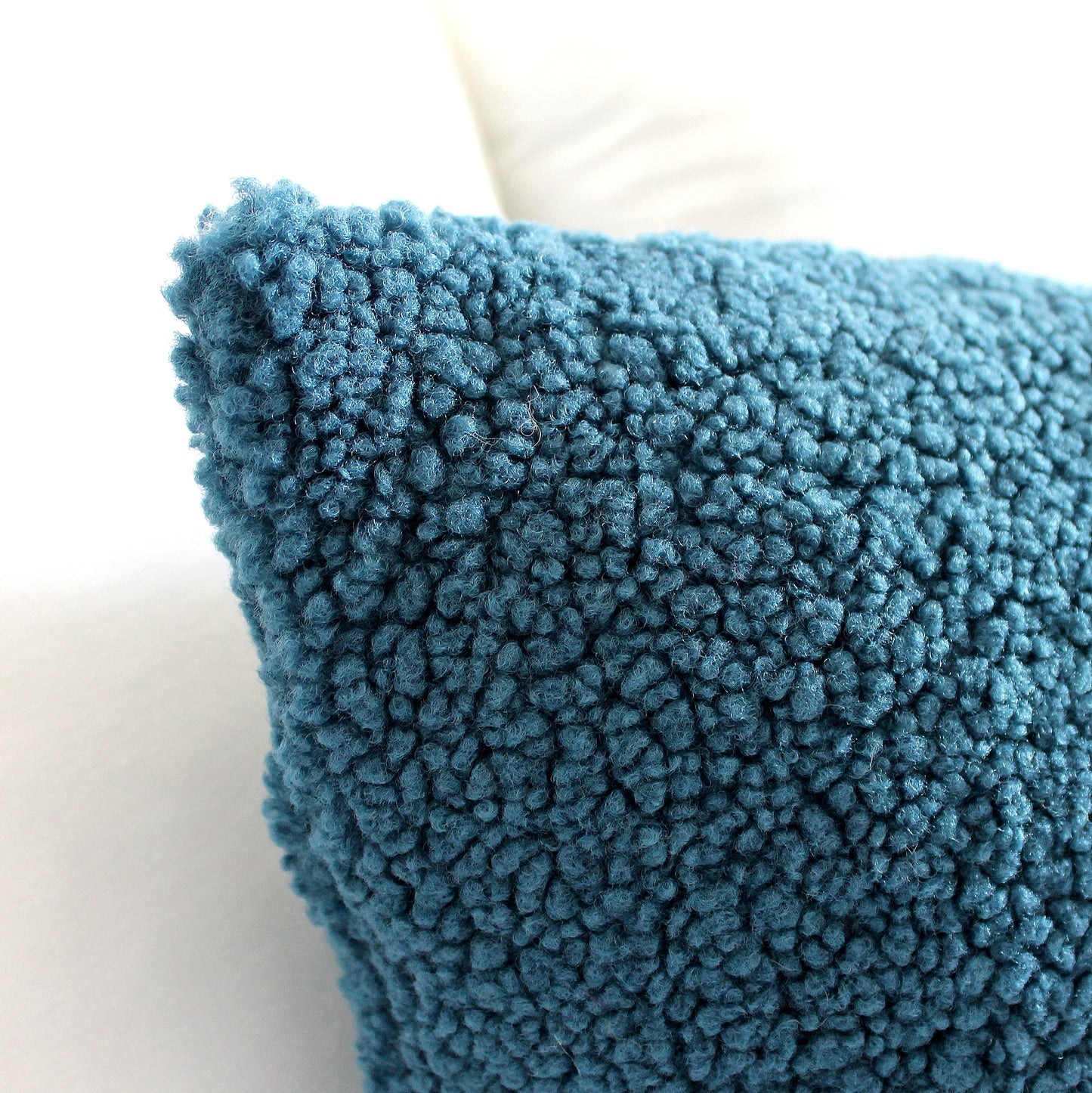Create a cozy look to your space with this Petrol Blue Cozy Teddy Boucle Throw Pillow Cover. The classic texture adds a warm and inviting touch to your sofa or bed. Comfortable to touch makes it perfect for snuggling up with!