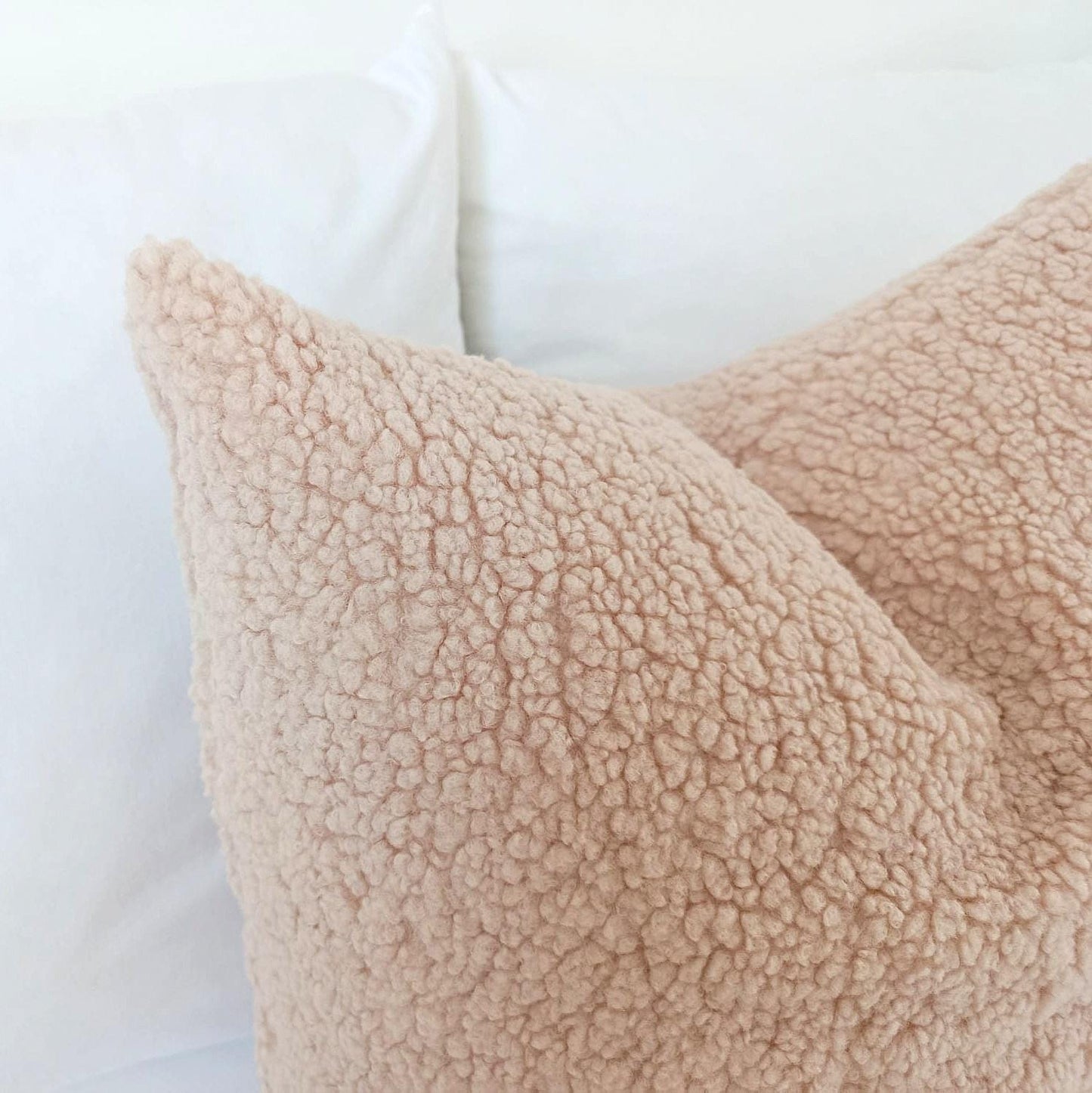 Close-up of the soft textured teddy bouclé fabric in champagne