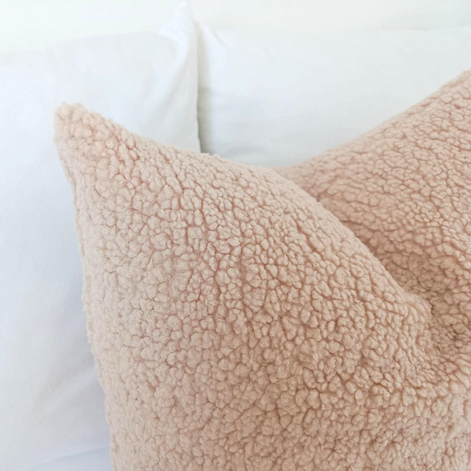 Close-up of the soft textured teddy bouclé fabric in champagne