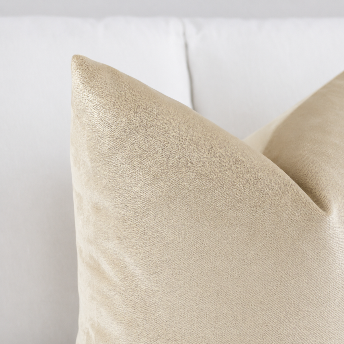 Bone beige velvet pillow cover in warm sand neutral tone, luxury cream cushion for modern minimalist decor.