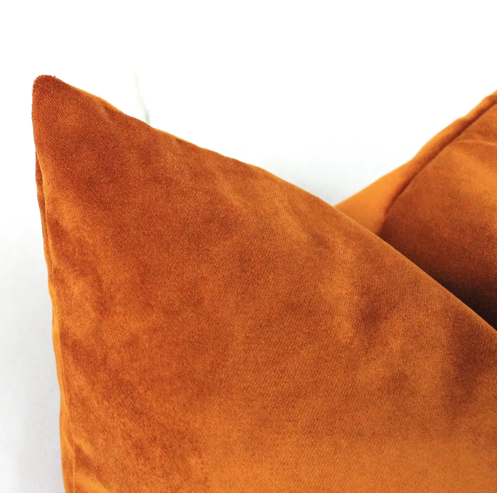 burnt orange velvet pillow cover in warm rust terracotta tone, cozy accent cushion for neutral sofa and autumn home styling