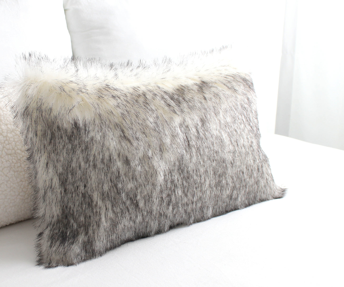 Luxury wolf faux fur cushion cover with hidden zipper and heavyweight cotton backing.