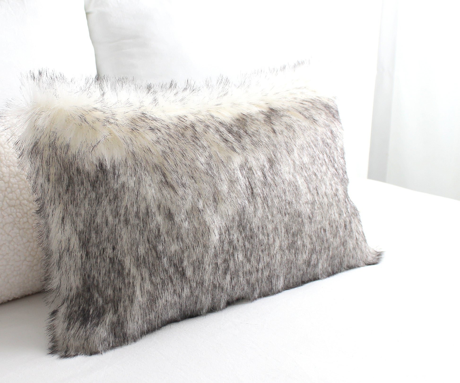Luxury wolf faux fur cushion cover with hidden zipper and heavyweight cotton backing.