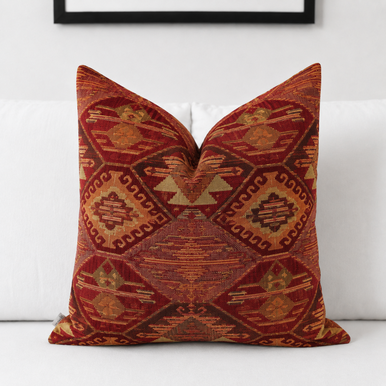 Red rust kilim lumbar pillow cover styled on a white bed