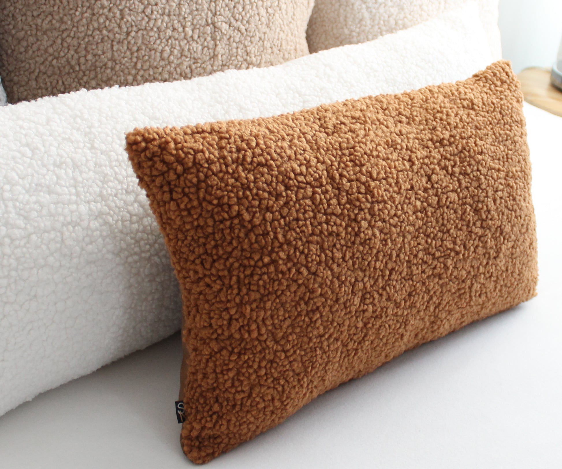 Create a cozy look to your space with this Light Brown Cozy Teddy Boucle Throw Pillow Cover. The classic texture adds a warm and inviting touch to your sofa or bed. Comfortable to touch makes it perfect for snuggling up with!