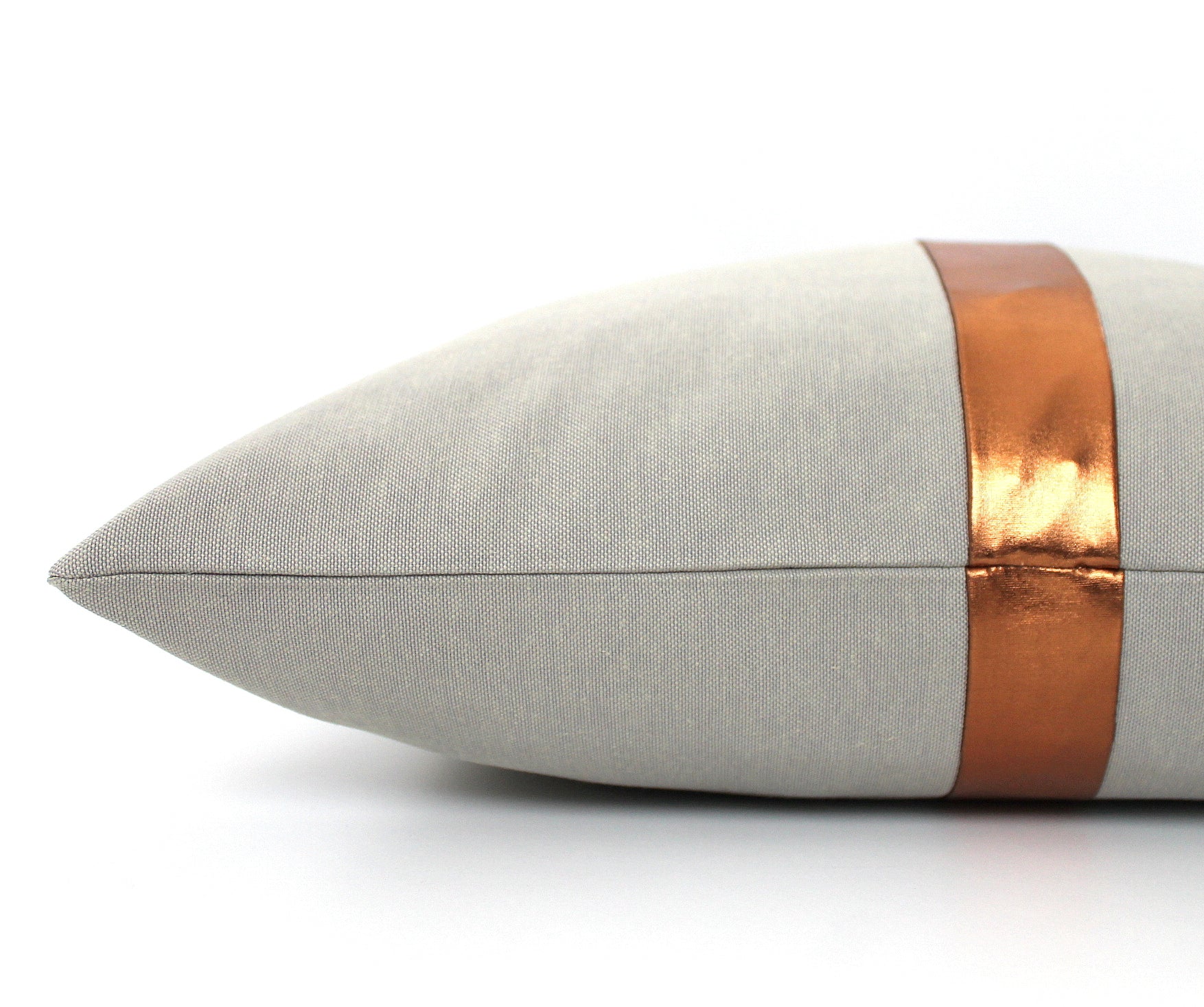 These affordable pillow covers are a must if you are looking for a touch of luxury in your home. The light grey cotton is made to pop with a custom stripe of silver, gold or copper or shiny black.