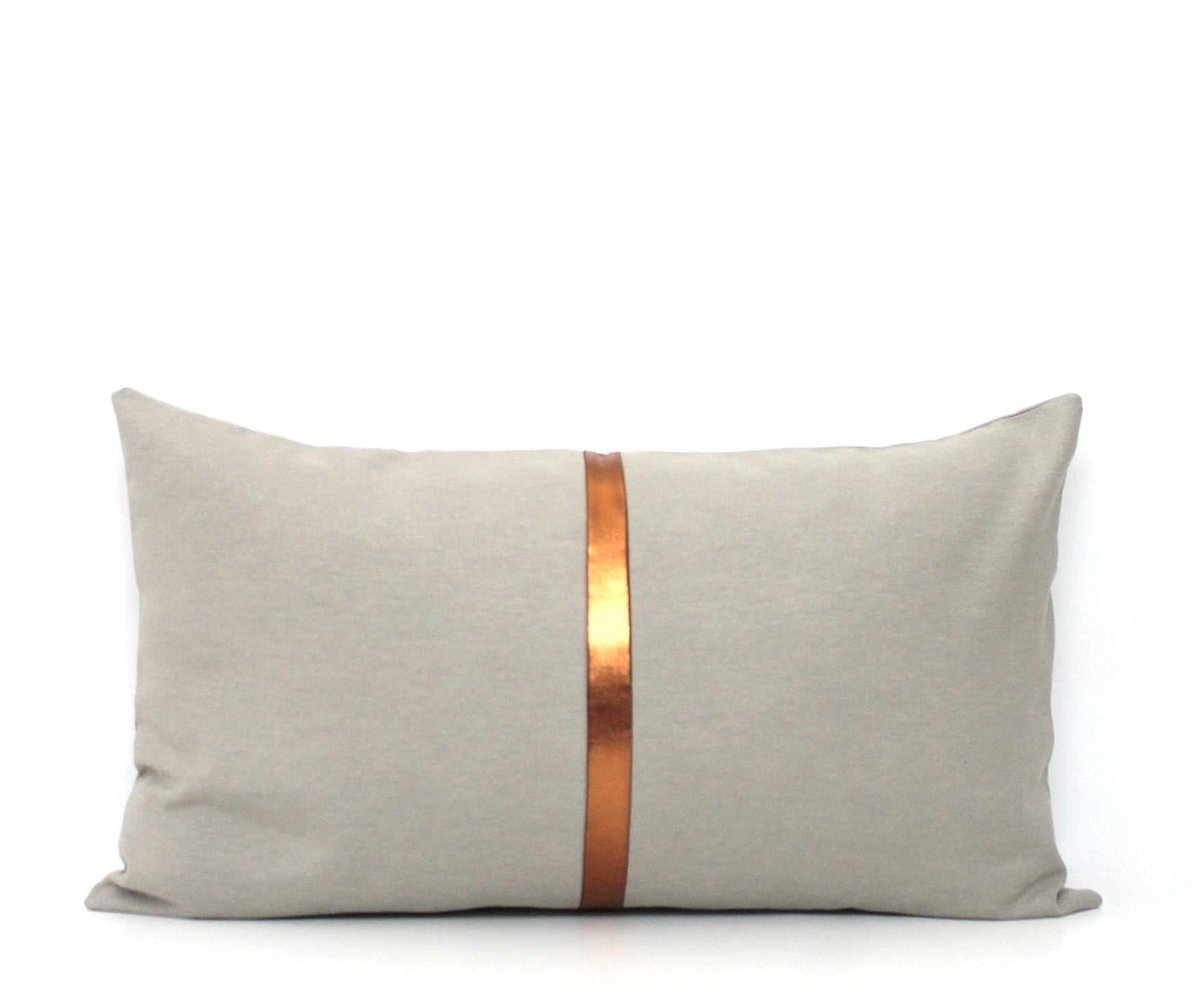 These affordable pillow covers are a must if you are looking for a touch of luxury in your home. The light grey cotton is made to pop with a custom stripe of silver, gold or copper or shiny black.