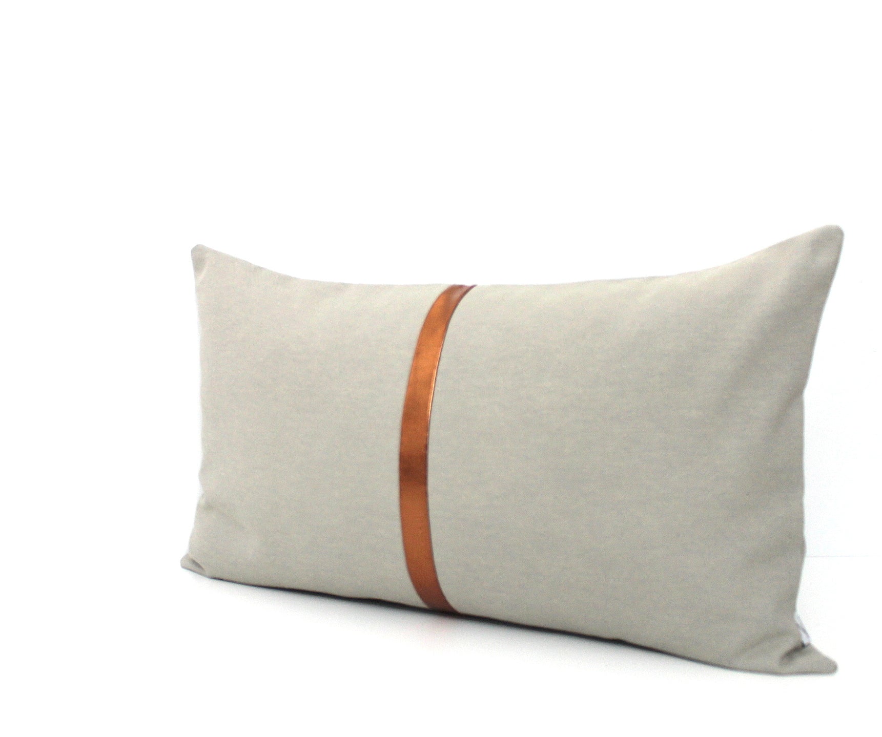 These affordable pillow covers are a must if you are looking for a touch of luxury in your home. The light grey cotton is made to pop with a custom stripe of silver, gold or copper or shiny black.